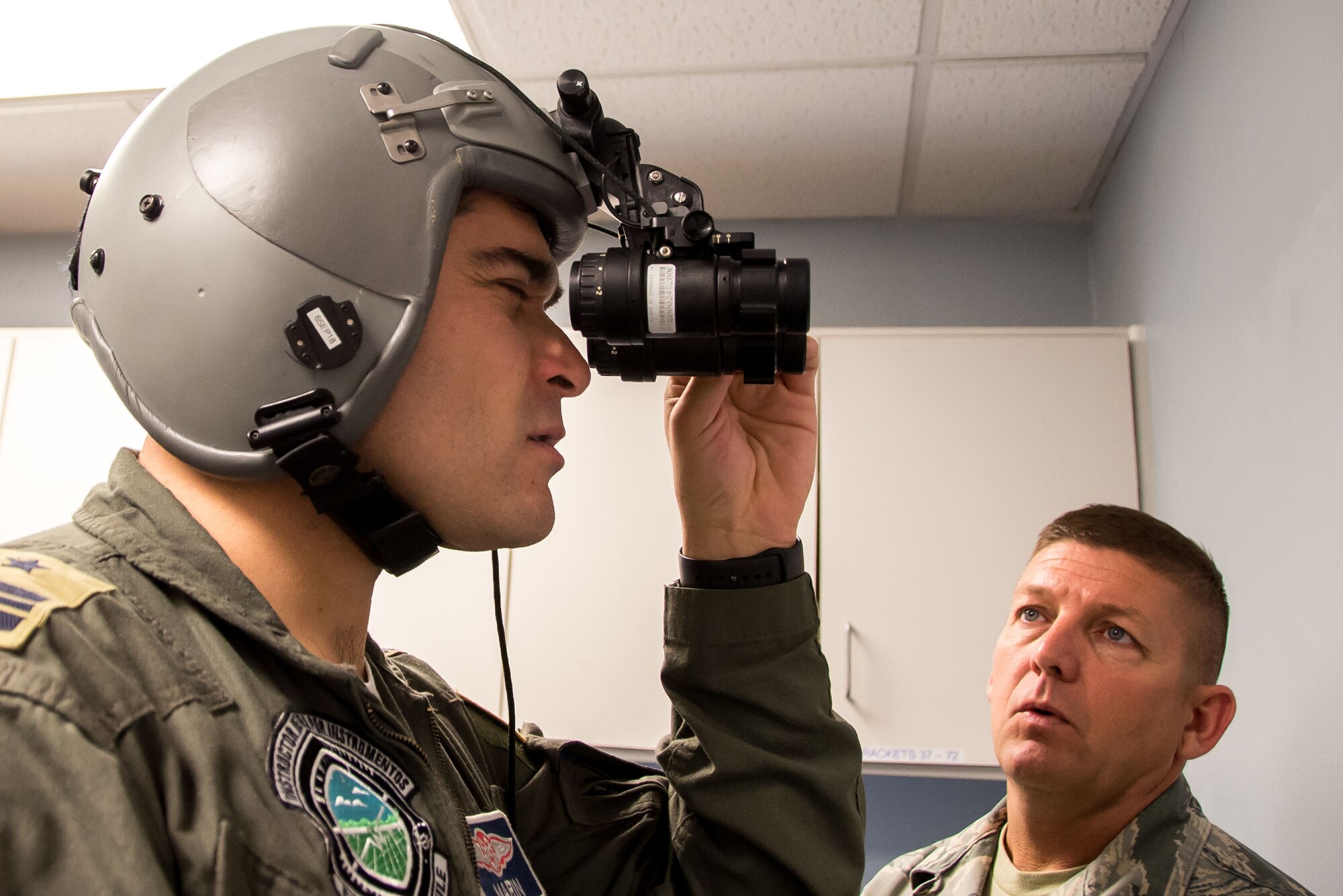 Chilean Air Force Maj. F. Marin, a C-130 pilot with the N10 Squadron, lines up the lenses on night vision goggles July 24, 2018, at Naval Air Station Fort Worth Joint Reserve Base, Texas. Marin visited the wing as part of the State Partnership Program, which forges mutually beneficial partnerships with some of the 136th Airlift Wing’s staunchest allies and partners worldwide.