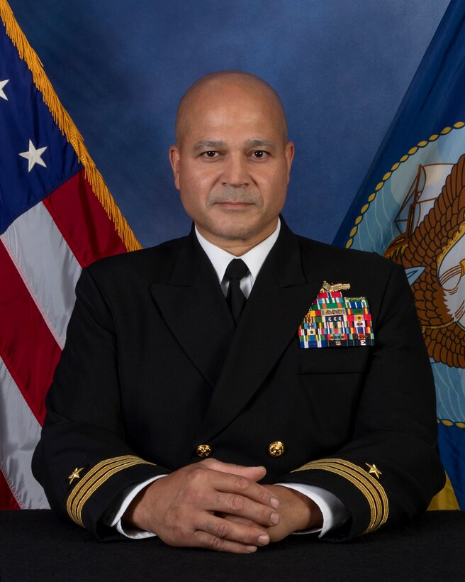 Commander Carlos J. Cintron is originally from Buffalo, NY. He earned a B.S. in Chemistry at Rochester Institute of Technology in 1993 and was subsequently commissioned through the ROTC program at the University of Rochester.