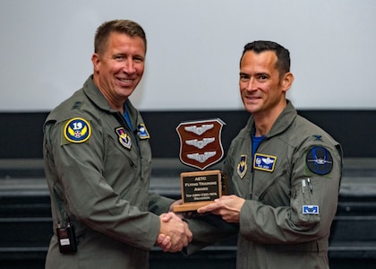 Maj. Gen. Patrick Doherty, 19th Air Force commander, presents the Top Combat Systems Operator/Remotely Piloted Aircraft/Air Battle Manager Squadron Award to the 337th air Control Squadron, during the Air Education and Training Command Flying Training Awards Ceremony Oct. 26, 2018, at Joint Base San Antonio-Randolph, Texas. The award ceremony recognizes individuals, squadrons, groups and wings whose efforts have led to the highest levels of student production.
