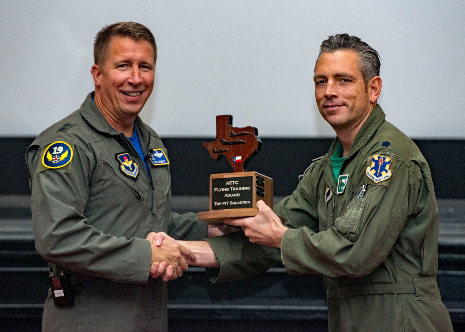 Maj. Gen. Patrick Doherty, 19th Air Force commander, presents the Top Pilot Instructor Training Squadron Award to the 560th Flying Training Squadron, during the Air Education and Training Command Flying Training Awards Ceremony Oct. 26, 2018, at Joint Base San Antonio-Randolph, Texas. The award ceremony recognizes individuals, squadrons, groups and wings whose efforts have led to the highest levels of student production.