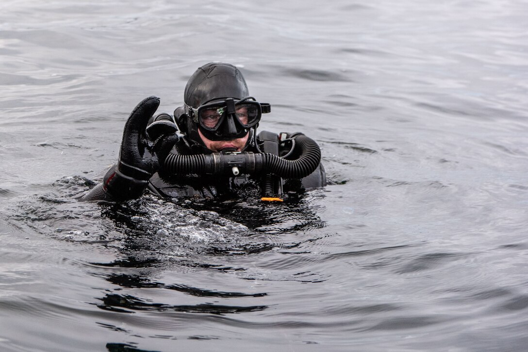 A German navy diver identifies a mine during Exercise Trident Juncture in Norway.