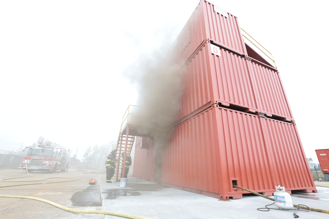 Dozens of firefighters aboard Marine Corps Logistics Base Albany got a chance to build some critical skills thanks to a new live fire structural trainer, October 25. The installation recently purchased the structural trainer; the original cement structure was condemned 10 years ago. (U.S. Marine Corps photo by Re-Essa Buckels)