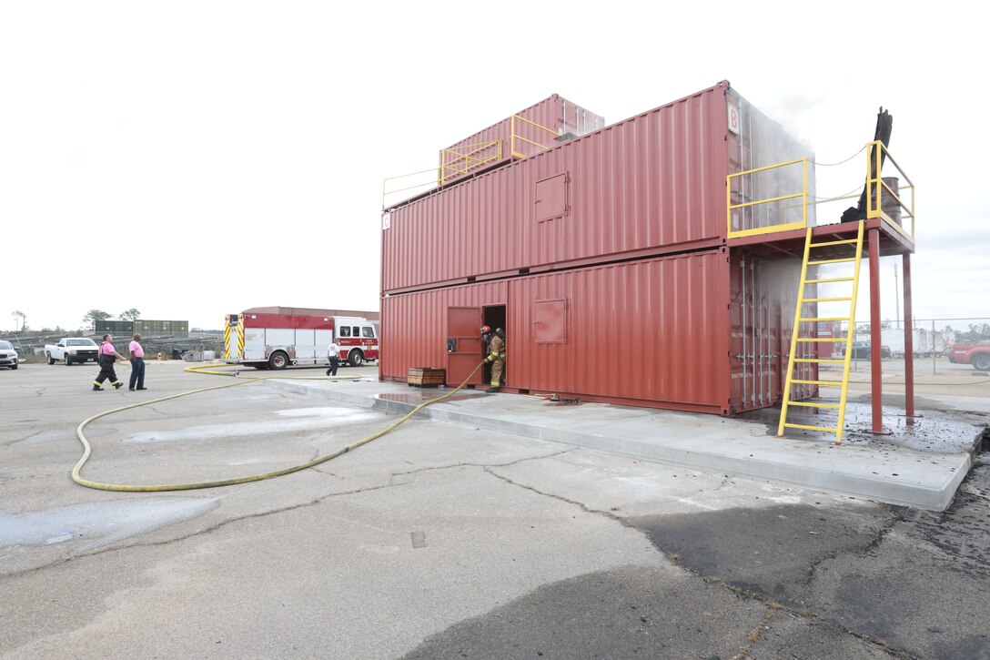 Dozens of firefighters aboard Marine Corps Logistics Base Albany got a chance to build some critical skills thanks to a new live fire structural trainer, October 25. The installation recently purchased the structural trainer; the original cement structure was condemned 10 years ago. (U.S. Marine Corps photo by Re-Essa Buckels)