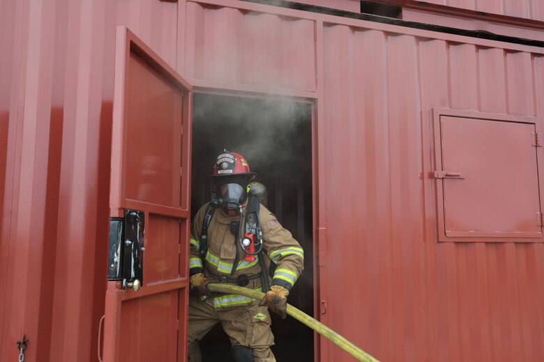 Dozens of firefighters aboard Marine Corps Logistics Base Albany got a chance to build some critical skills thanks to a new live fire structural trainer, October 25. The installation recently purchased the structural trainer; the original cement structure was condemned 10 years ago. (U.S. Marine Corps photo by Re-Essa Buckels)