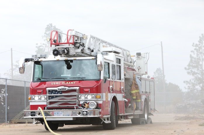 Dozens of firefighters aboard Marine Corps Logistics Base Albany got a chance to build some critical skills thanks to a new live fire structural trainer, October 25. The installation recently purchased the structural trainer; the original cement structure was condemned 10 years ago. (U.S. Marine Corps photo by Re-Essa Buckels)