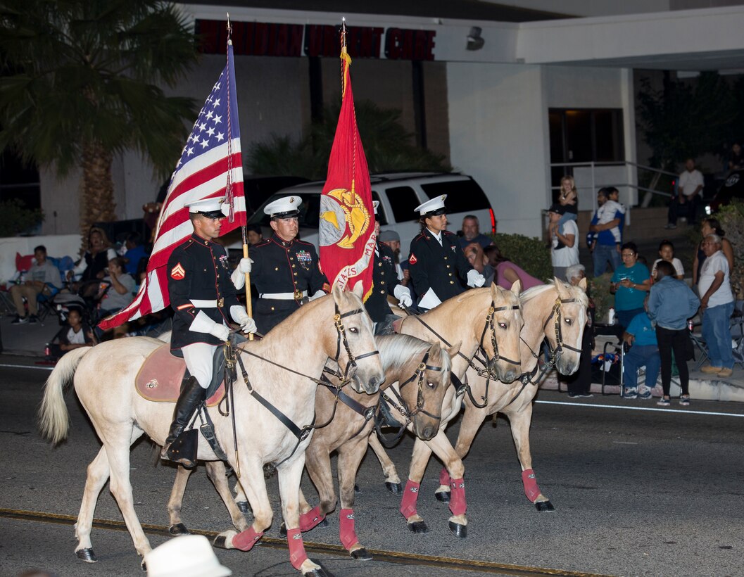 The Marine Corps Mounted Color Guard presents the colors while taking the lead of the 86th annual Kiwanis Club Mardi Gras Parade, Oct. 27. The parade was originally on Halloween but was changed to the weekend prior to allow the children to go trick or treating.