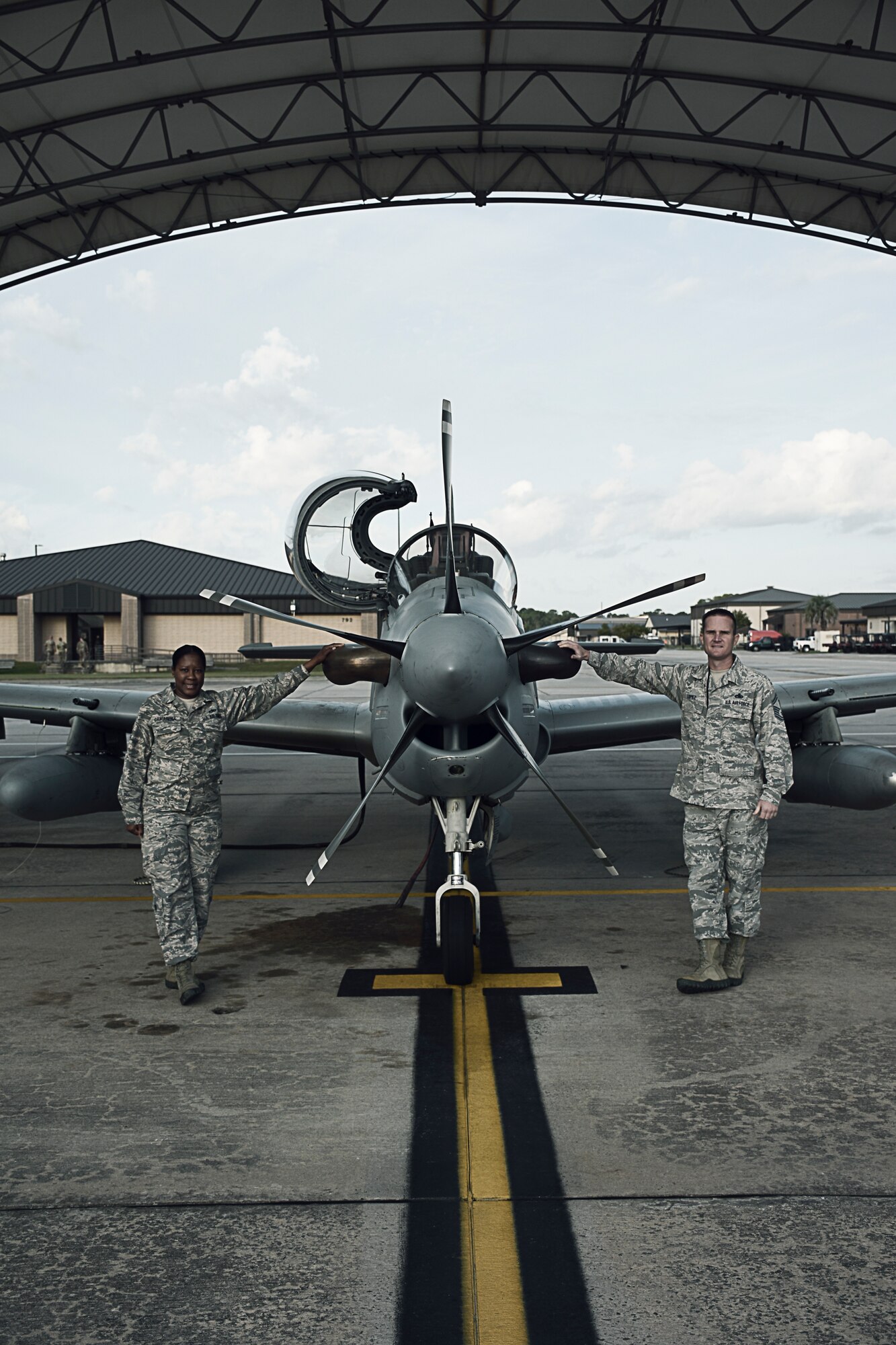 Senior Master Sgt. Scott Lopez, the maintenance superintendent for the 476th Maintenance Squadron at Moody Air Force Base, Ga., and Tech. Sgt. Lauren Camarena, an electrical and environmental systems craftsman with the 476 MXS, pose with an A-29 Super Tucano October 25, 2018, at Moody AFB.