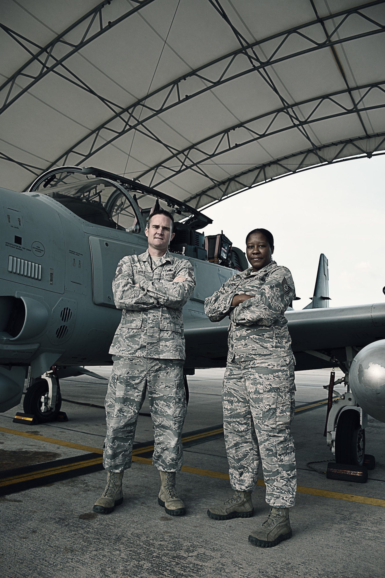 Senior Master Sgt. Scott Lopez, the maintenance superintendent for the 476th Maintenance Squadron at Moody Air Force Base, Ga., and Tech. Sgt. Lauren Camarena, an electrical and environmental systems craftsman with the 476 MXS, pose with an A-29 Super Tucano October 25, 2018, at Moody AFB.