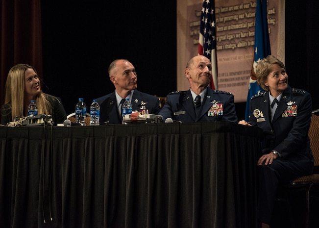Mandy Vaughn, President of VOX space, Chief Master Sgt. Larry Williams, Air Mobility Command commander, Gen. Mike Holmes, Air Combat Command commander, and Gen. Maryanne Miller, AMC commander listen to a presentation from one of AMC�s innovators during the 2018 AMC Phoenix Spark Tank competition, Grapevine, Texas, Oct. 27, 2018. The winner, Staff Sgt. Travis Alton from the 19th Logistics Readiness Squadron, won at the command level and will advance to the Air Force-level competition. A/TA, AMC's premier professional development event, provides mobility Airmen an opportunity to learn about and discuss mobility priorities, issues, challenges, and successes. The venue creates dialogue between industry experts and Air Force and Department of Defense about ways to innovate, enhance mission effects and advance readiness headed into the future.   (U.S. Air Force photo by Tech. Sgt. Jodi Martinez)