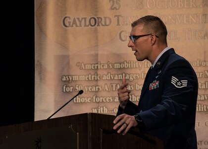 Staff Sgt. Travis Alton from the 19th Logistical Readiness Squadron briefs his design of an M-1 cargo parachute release assembly time block fair safe during the 2018 AMC Phoenix Spark Tank competition, where four finalists pitched their innovation ideas to a panel of judges at the
Airlift/Tanker Association Symposium in Grapevine, Texas, Oct. 27, 2018. "At the end of the day, for less than a dollar, we can save millions," said Alton. "But let's think further than that. Think about the warfighter downrange that is reliant on the Humvee, the Howitzer, and the ammunition to save their lives... Wouldn't it be a shame if their cargo was destroyed because they didn't have this one dollar block installed?" A/TA, AMC's premier professional development event, provides mobility Airmen an opportunity to learn about and discuss mobility priorities, issues, challenges, and successes. The venue
creates dialogue between industry experts and Air Force and Department of Defense about ways to innovate, enhance mission effects and advance readiness headed into the future. (U.S. Air Force photo by Tech. Sgt. Jodi Martinez)