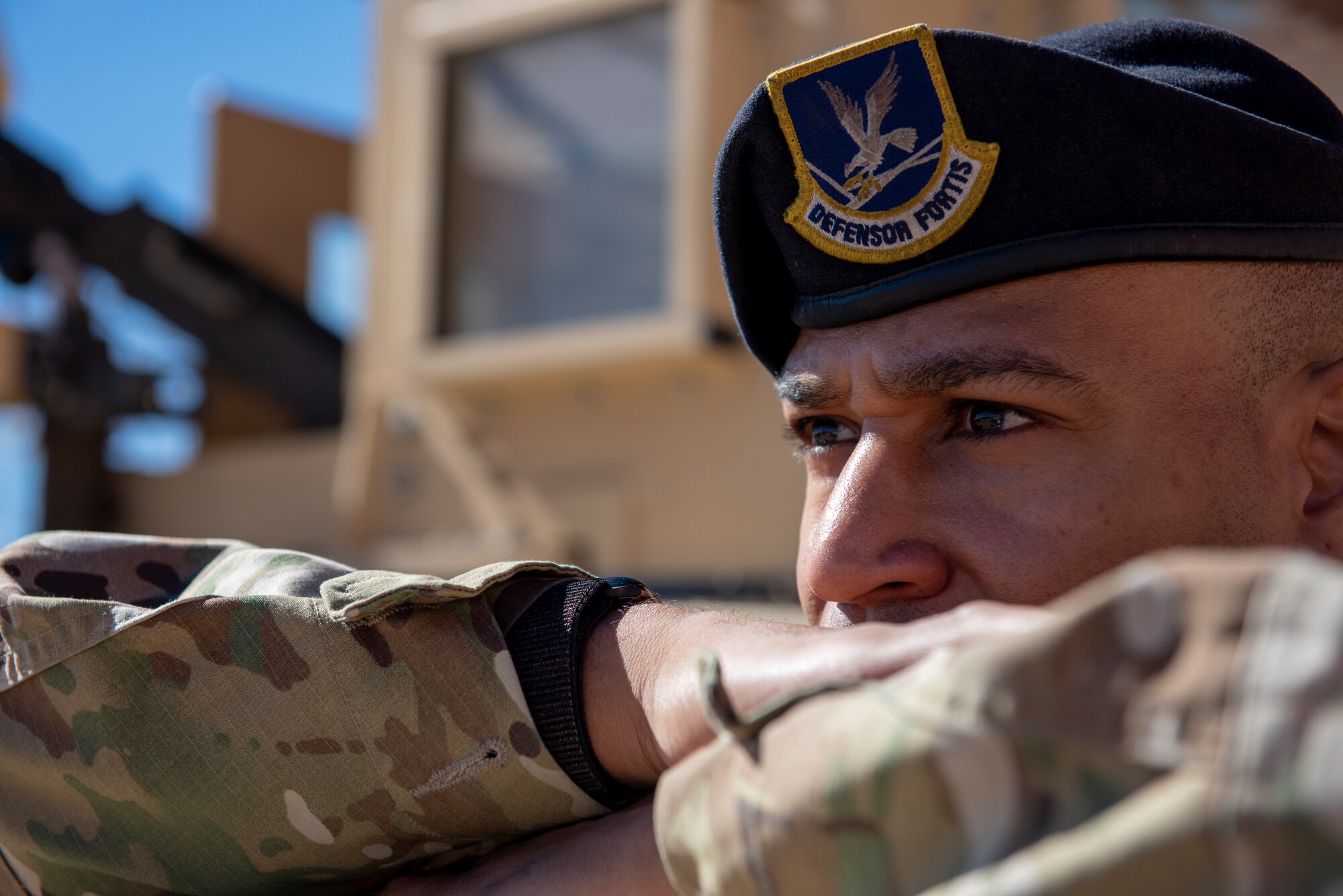 U.S. Air Force Master Sgt. Jerbaine Dancy 377th Security Support Squadron flight superintendent, watches the military working dog exhibition at U.S. Air Force Day at the Acoma Pueblo, Oct. 27. (U.S. Air Force photo by Staff Sgt. J.D. Strong II)