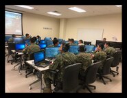 Cadets from Chile's Bernardo O'Higgins Military Academy experience technology day at Fort Benning. The cadets had hands-on experience at Clarke Simulations Center operating the Virtual Battlespace 3 and the Reconfigurable Vehicle Simulator. (Photo Credit: U.S. Army)