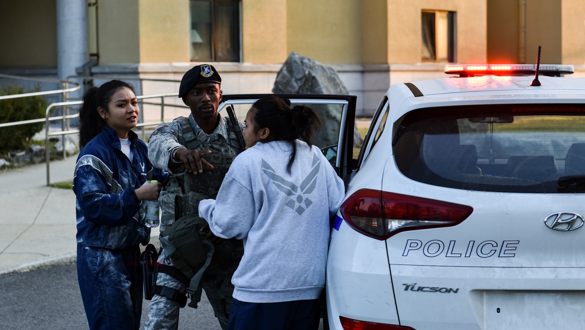 U.S. Air Force Tech. Sgt. Richard Carter, member of the 8th Security Forces Squadron, instructs two simulated victims to move to a designated area at Kunsan Air Base, Republic of Korea, Oct. 17, 2018. Multiple emergency response personnel reacted to a simulated biological threat in order to assess the 8th Fighter Wing’s readiness and response capabilities. (U.S. Air Force photo by Senior Airman Stefan Alvarez)