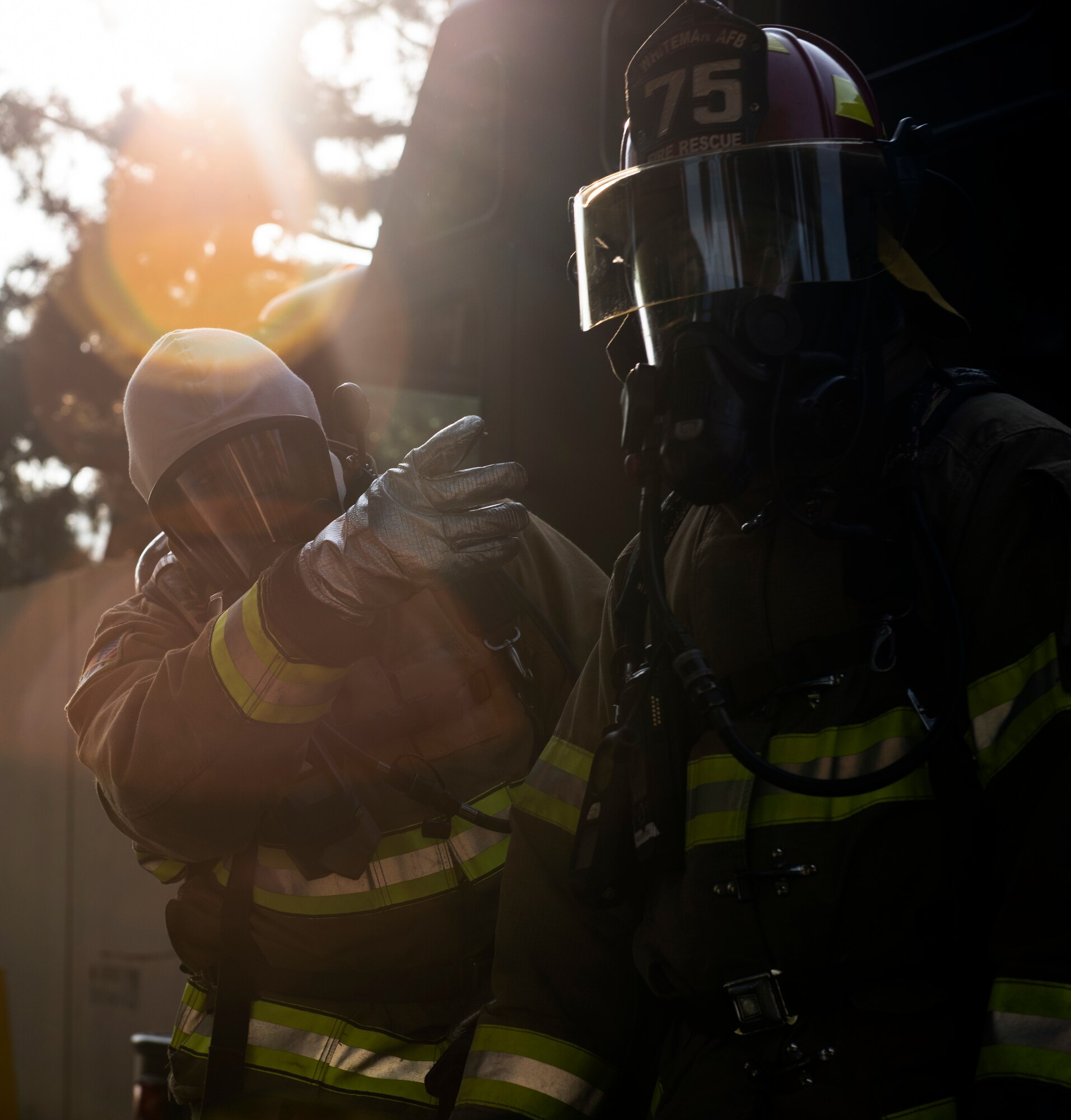 8th Civil Engineering Squadron fire fighters confer with each other on the best approach to a controlled area  at Kunsan Air Base, Republic of Korea, Oct. 17, 2018. Kunsan’s fire department led the rescue and decontamination effort with specialized equipment in order to keep themselves protected throughout the response  (U.S. Air Force photo by Senior Airman Stefan Alvarez)
