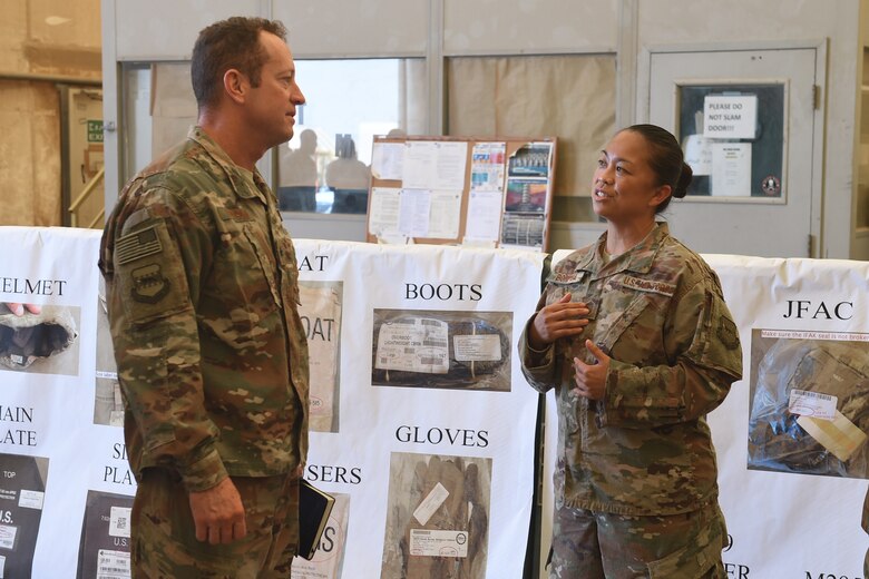 Airmen from the 407th AEG give Brig. Gen. Iverson a tour of the base.