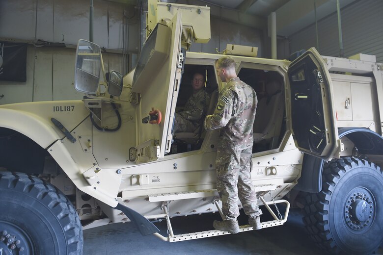 Airmen from the 407th AEG give Brig. Gen. Iverson a tour of the base.