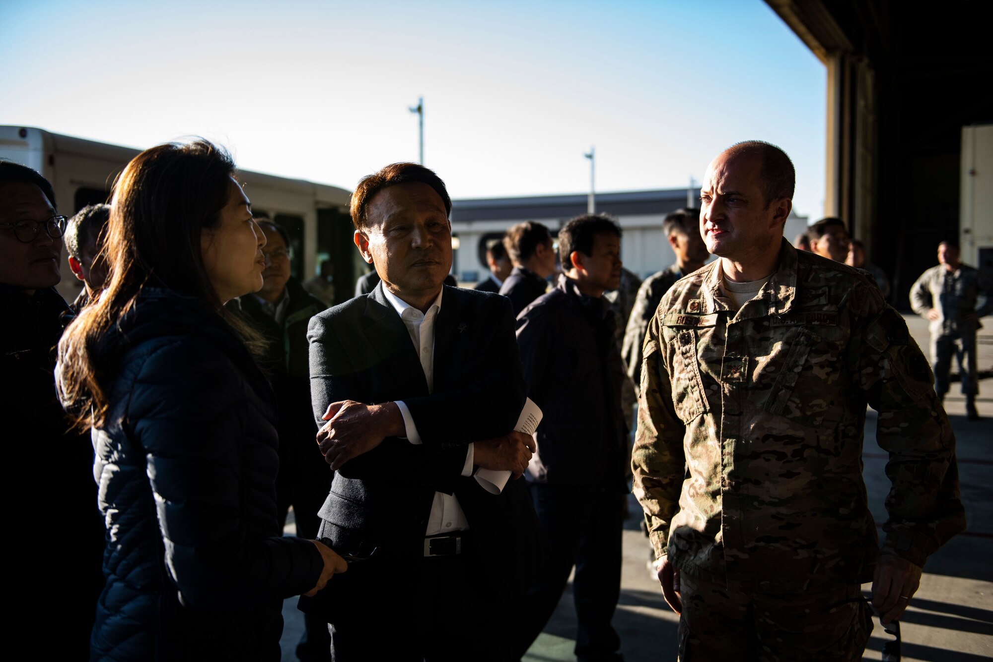 Col. John Bosone, 8th Fighter Wing commander (right), gives a tour to Kang Imjune, Mayor of Gunsan (middle), at Kunsan Air Base, Republic of Korea, Oct. 19, 2018. Mayor Imjune had a chance to see first-hand the capabilities and partnership the 8th FW brings to the Korean Peninsula with the help of Republic of Korea Air Force partners.  (U.S. Air Force photo by Senior Airman Stefan Alvarez)