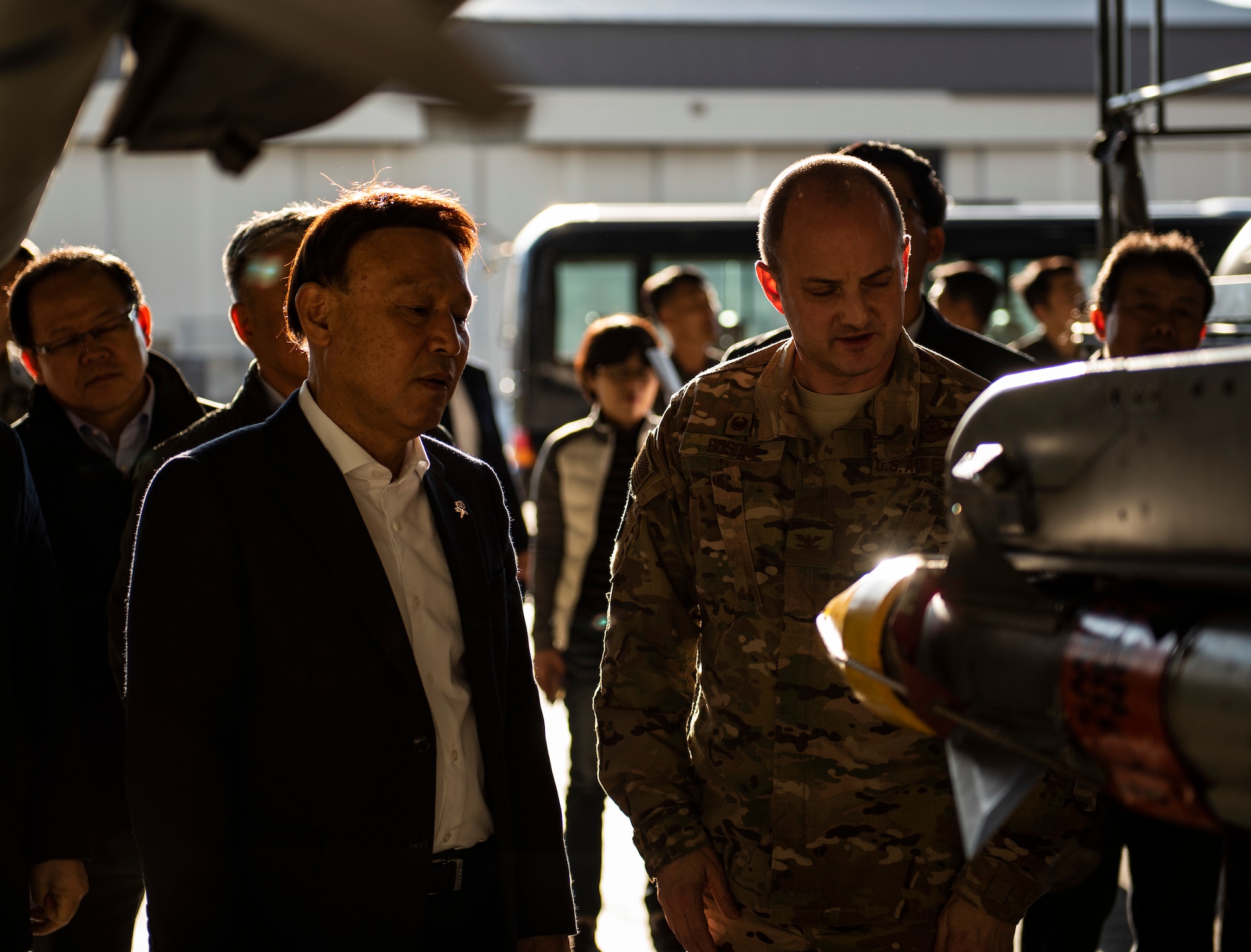 Col. John Bosone, 8th Fighter Wing commander (right), explains features of an F-16 Fighting Falcon to Kang Imjune, Mayor of Gunsan (left), at Kunsan Air Base, Republic of Korea, Oct. 19, 2018. Mayor Imjune was shown the different ways Kunsan AB contributes to the overall safety and security of the Korean Peninsula.   (U.S. Air Force photo by Senior Airman Stefan Alvarez)