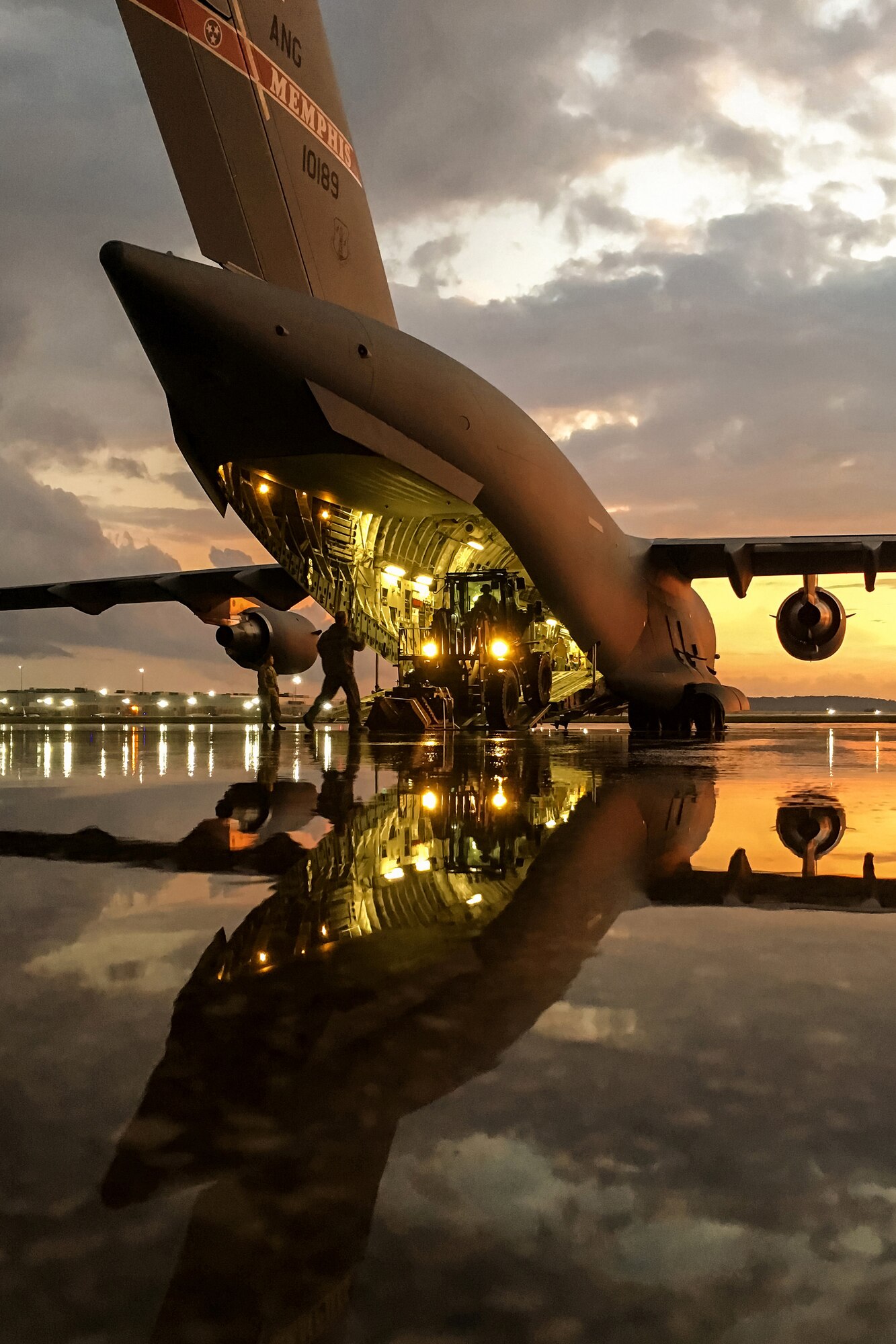 This photo, depicting Airmen deploying from the Kentucky Air National Guard base for disaster-relief operations following Hurricane Harvey, won first place in the News Photo competition of the 2017 National Guard Bureau Media Contest.  (U.S. Air National Guard photo by Lt. Col. Dale Greer)