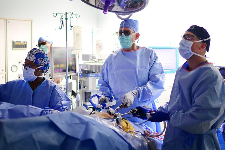 U.S. Air Force Major Richard Knight (center), Diplomate of the American Board of Urology, Chief of Surgery at the 48th Medical Group, performs a laparoscopic radical prostatectomy surgery using FlexDex technology at Royal Air Force Lakenheath, England Oct. 18, 2018. A single instrument averages around $500, a fraction of the cost of robotic surgical systems which average at $2-million dollars. (U.S. Air Force photo/ Tech. Matthew Plew)