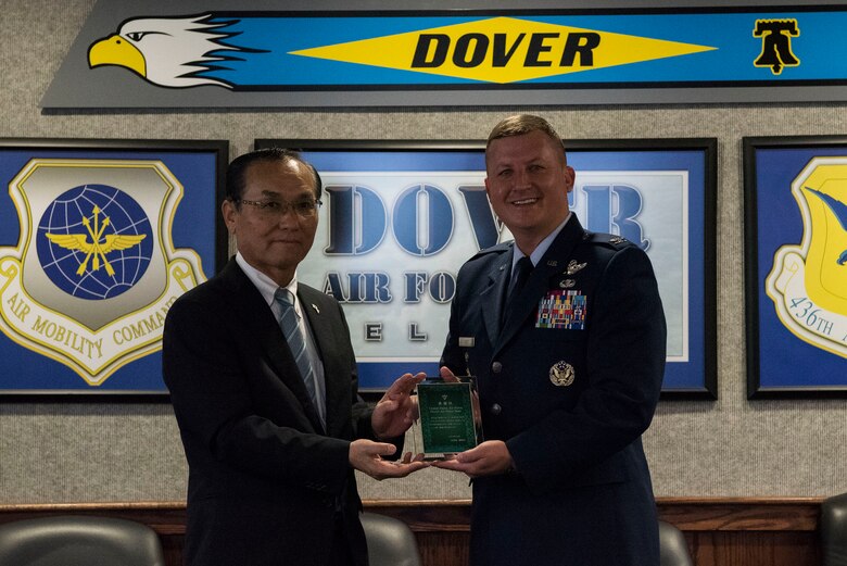 Hiroo Kikuchi, Iwanuma City mayor, presents Col. Matthew Jones, 436th Airlift Wing vice commander, with a plaque Oct. 23, 2018, at Dover Air Force Base, Del. Kikuchi and several other representatives of Iwanuma, Japan, visited Dover, their “friendship city,” to thank the community who helped them during a 9.0 magnitude earthquake and subsequent tsunami that devastated the northern coast of Japan in 2011. (U.S. Air Force photo by Airman 1st Class Zoe M. Wockenfuss)