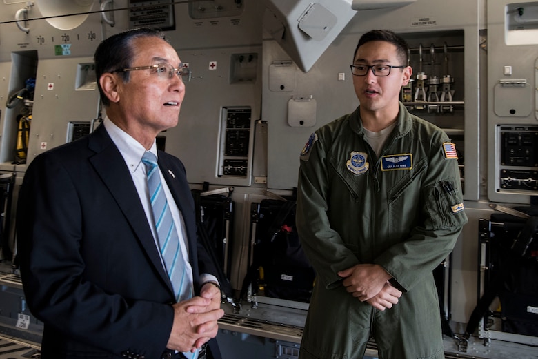 Hiroo Kikuchi, Iwanuma City mayor, speaks with Senior Airman Alex Yang, 3rd Airlift Squadron loadmaster, during a tour of a C-17 Globemaster III Oct. 23, 2018, at Dover Air Force Base, Del. During Operation Tomodachi in 2011, Dover C-17s airlifted humanitarian aid to the Miyagi Prefecture, the state in which Iwanuma resides, which fortified the friendship between the two states that still exists today. (U.S. Air Force photo by Airman 1st Class Zoe M. Wockenfuss)