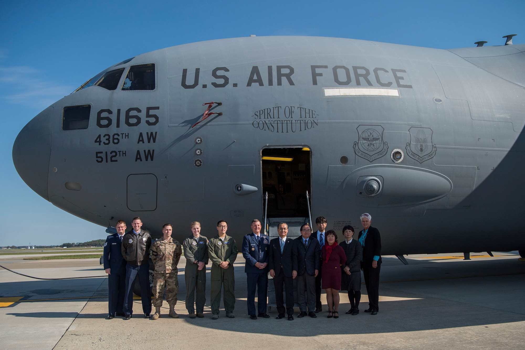 Delegates from Iwanuma, Japan, pose alongside members of Team Dover for a group photo Oct. 23, 2018, at Dover Air Force Base, Del. Since 2004, the city of Dover has had a friendship with the Miyagi Prefecture that began when Team Dover started hosting an annual visit of middle school students from Iwanuma.(U.S. Air Force photo by Airman 1st Class Zoe M. Wockenfuss)