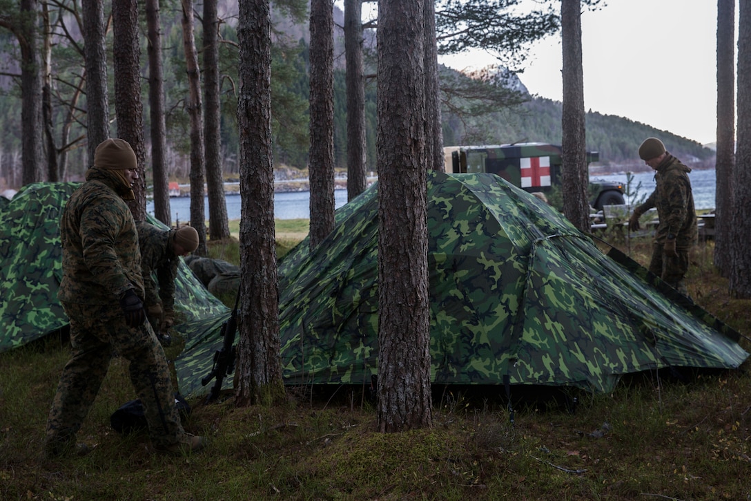 Marines establish a bivouac location during Trident Juncture 18 on Alvund Beach, Oct. 29, 2018 after being delivered ashore from USS Iwo Jima.