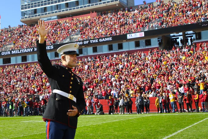 Chicago, Ill. native, Sgt. Nicholas Rojas, administrative specialist with Marine Corps Recruiting Station Des Moines, Iowa, is recognized as the “Hero of the Game” during the Iowa State University versus Texas Tech University football game at Jack Trice Stadium in Ames, Iowa, October 27, 2018.