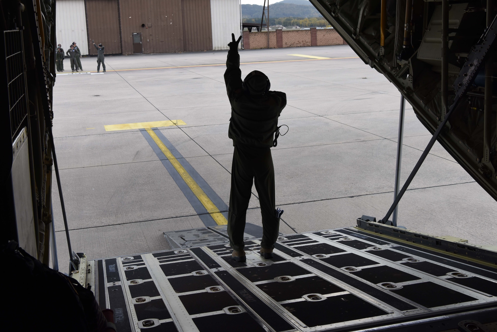 U.S. Air Force Maj. Maria Vazquez, 86th Aeromedical Evacuation Squadron medical crew director, instructs aeromedical evacuation technicians during an after-mission off-load on Ramstein Air Base, Germany, Oct. 23, 2018. Two flight nurses and three aeromedical evacuation technicians are the standard crew for an 86 AES mission.