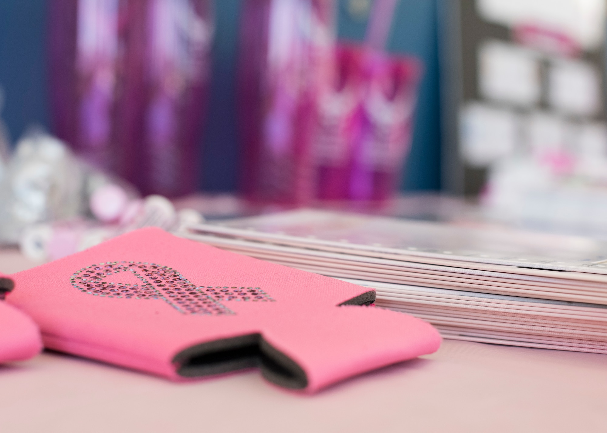 A pink drink sleeve is displayed during the 49th Medical Group’s Breast Cancer Awareness Month Celebration, October 25, 2018, at Holloman Air Force Base, N.M. The pink ribbon is an international symbol of breast cancer awareness, and represents moral support for those fighting breast cancer and breast cancer survivors. (U.S. Air Force photo by Staff Sgt. BreeAnn Sachs)