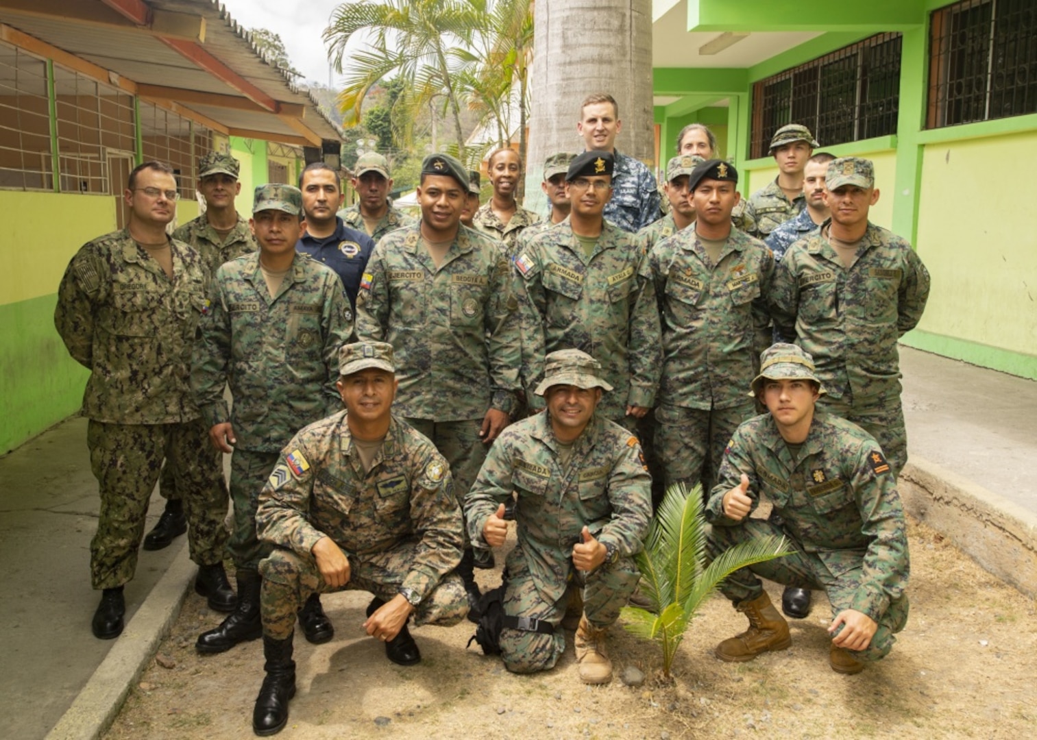 Canadian Forces Master Corporal Kristian Tam, discusses field medicine techniques during a multi-nation information exchange meeting on medicine in a tactical environment with American and Ecuadorian service members.