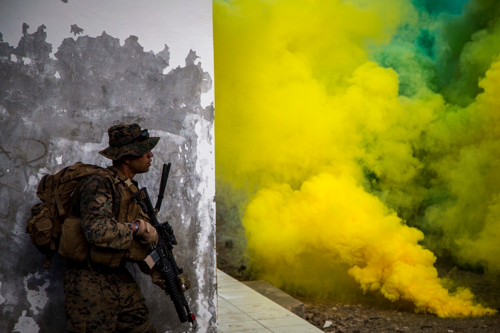 Marine with 3rd Battalion, 4th Marines, attached to Task Force Koa Moana 17, assesses area during raid for culminating event of Exercise Crocodilo in
Metinaro, Timor Leste, September 13, 2017 (U.S. Marine Corps/Juan C. Bustos)