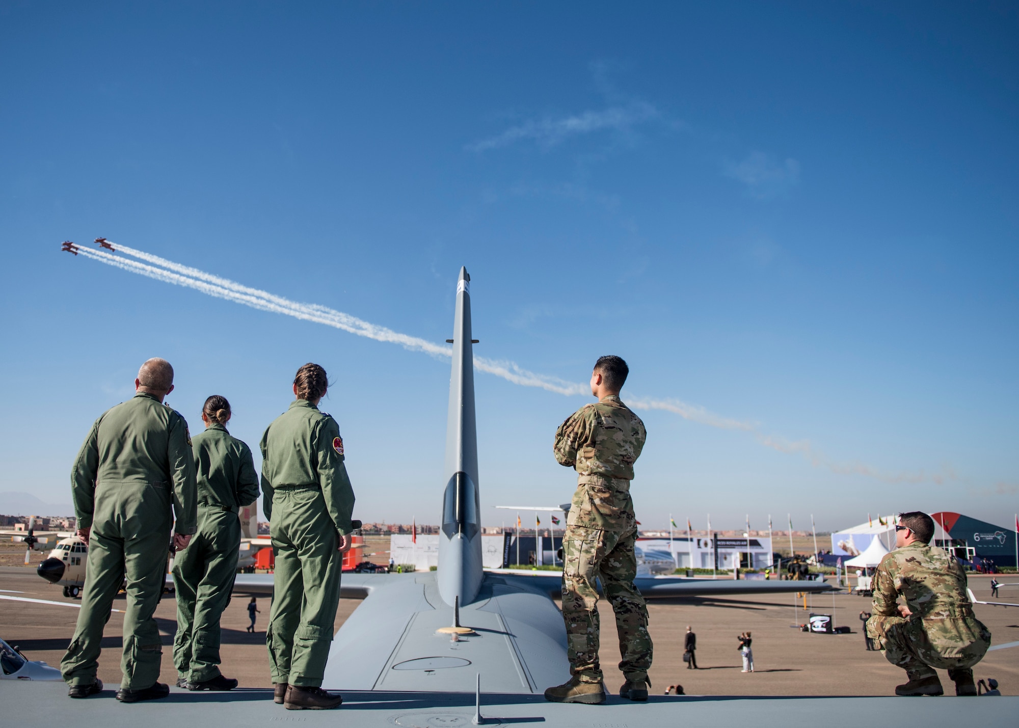MARRAKECH, Morocco (Oct 24, 2018) U.S. Air Force and British Royal Air Force Airmen spectate the 2018 Marrakech Air Show while on top of a C-130 Hercules. The air show provides a unique opportunity for the U.S. along with other military partners to showcase leadership in aerospace technologies while supporting various armament procurement competitions taking place throughout Europe and Africa. (DoD photo by Mass Communication Specialist 2nd Class Cody Hendrix)
