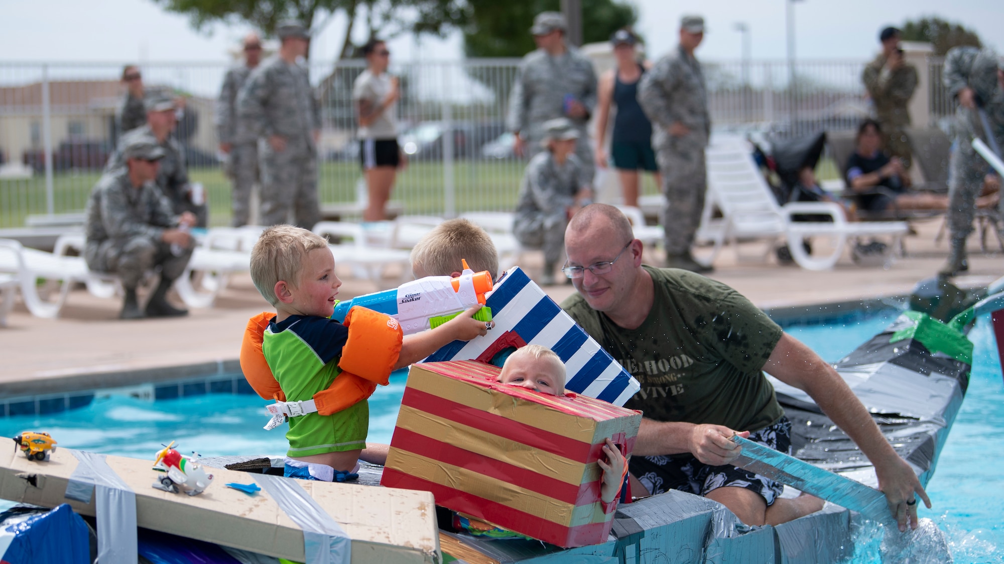 1st Lt. Joseph Foreman and his children compete in the Battle of the Battleships competition Aug. 30, 2018 here. (U.S. Air Force photo by Staff Sgt. JD Strong II)