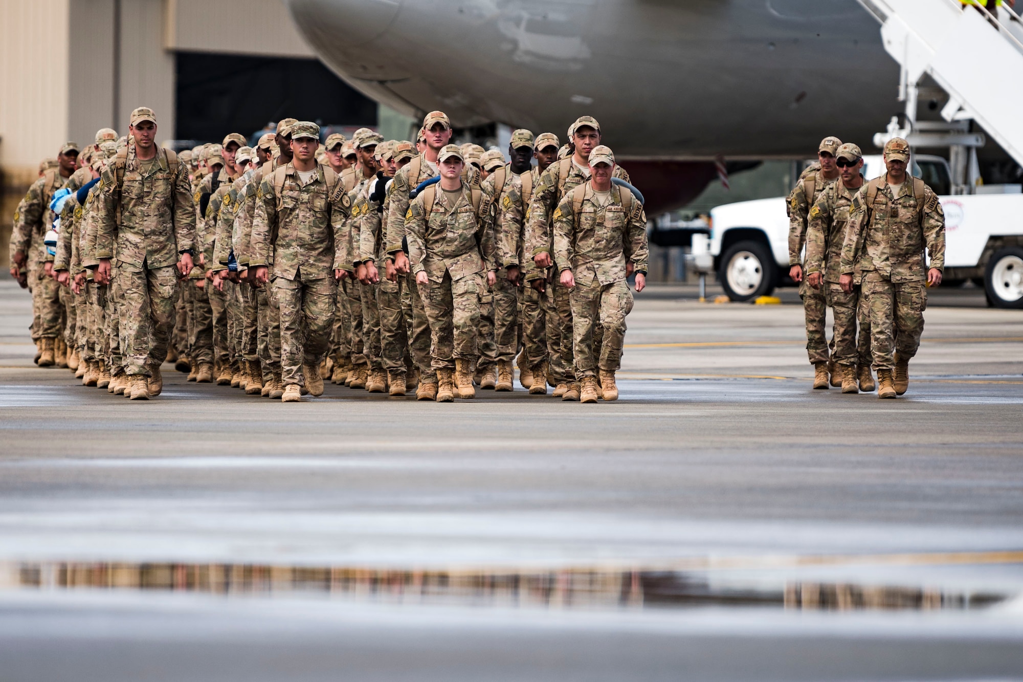 Airmen from the 823d Base Defense Squadron (BDS) march to their loved ones during a redeployment ceremony, Oct. 26, 2018, at Moody Air Force Base, Ga. The 822d, 823d and 824th BDS’s provide high-risk force protection and integrated base defense for expeditionary air forces. Airmen from the 823d BDS just returned home from conducting relief-in-place in the United States Africa Command theater while Airmen from the 824th BDS took their place. (U.S. Air Force photo by Airman Taryn Butler)
