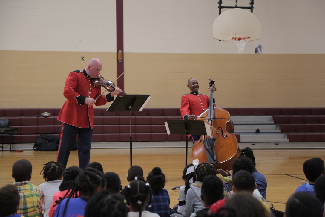 On Oct. 25, 2018, a string duo from "The President's Own" U.S. Marine Band presented a Music in the Schools program at the Benjamin D. Foulois Creative and Performing Arts Academy in Suitland, Md. (U.S. Marine Corps photo by Master Sgt. Kristin duBois/released)