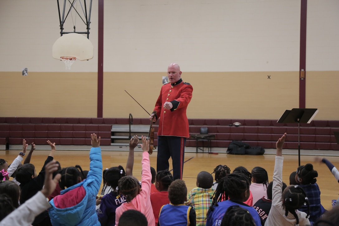 On Oct. 25, 2018, a string duo from "The President's Own" U.S. Marine Band presented a Music in the Schools program at the Benjamin D. Foulois Creative and Performing Arts Academy in Suitland, Md. (U.S. Marine Corps photo by Master Sgt. Kristin duBois/released)