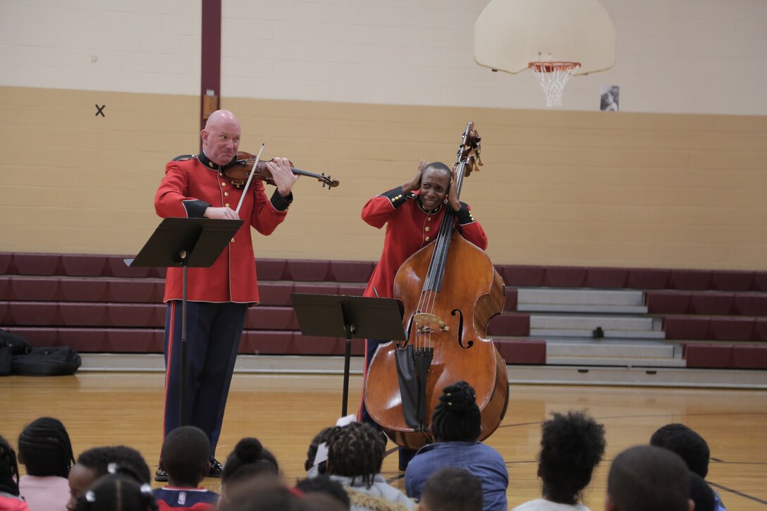 On Oct. 25, 2018, a string duo from "The President's Own" U.S. Marine Band presented a Music in the Schools program at the Benjamin D. Foulois Creative and Performing Arts Academy in Suitland, Md. (U.S. Marine Corps photo by Master Sgt. Kristin duBois/released)