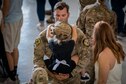 Tech. Sgt. Cliff Coppenbarger, 823d Base Defense Squadron (BDS) squad leader, holds his daughter during a redeployment ceremony, Oct. 26, 2018, at Moody Air Force Base, Ga. The 822d, 823d and 824th BDS’s provide high-risk force protection and integrated base defense for expeditionary air forces. Airmen from the 823d BDS just returned home from conducting relief-in-place in the United States Africa Command theater while Airmen from the 824th BDS took their place. (U.S. Air Force photo by Airman Taryn Butler)