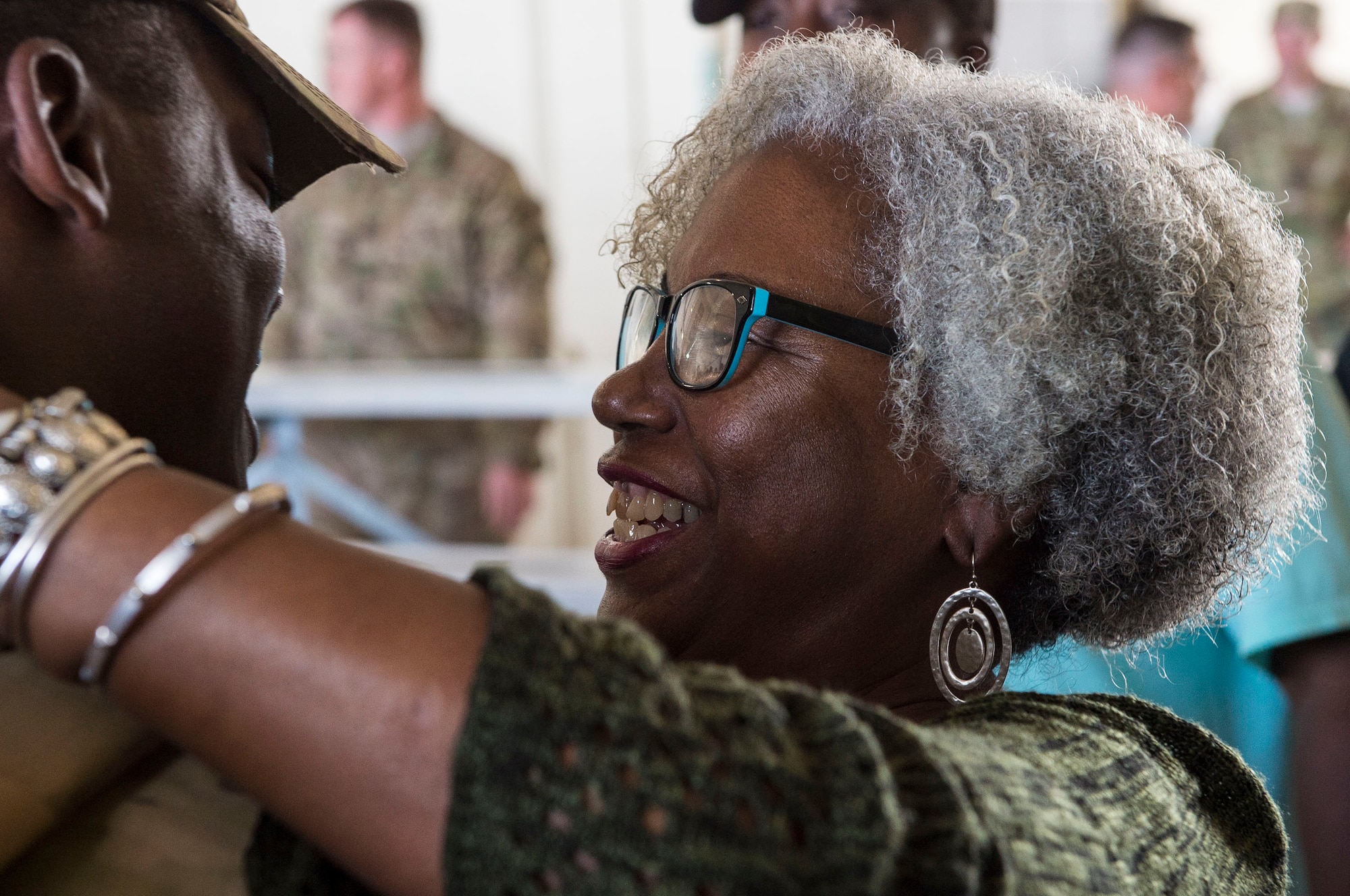 An Airman from the 823d Base Defense Squadron (BDS), embraces a loved one during a redeployment, Oct. 26, 2017, at Moody Air Force Base, Ga. The 822d, 823d and 824th BDS’s provide high-risk force protection and integrated base defense for expeditionary air forces. Airmen from the 823d BDS just returned home from conducting relief-in-place in the United States Africa Command theater while Airmen from the 824th BDS took their place. (U.S. Air Force photo by Senior Airman Janiqua P. Robinson)