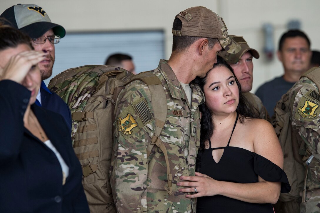 Capt. Justin Wilson 823d Base Defense Squadron (BDS), embraces a loved one during a redeployment, Oct. 26, 2017, at Moody Air Force Base, Ga. The 822d, 823d and 824th BDS’s provide high-risk force protection and integrated base defense for expeditionary air forces. Airmen from the 823d BDS just returned home from conducting relief-in-place in the United States Africa Command theater while Airmen from the 824th BDS took their place. (U.S. Air Force photo by Senior Airman Janiqua P. Robinson)