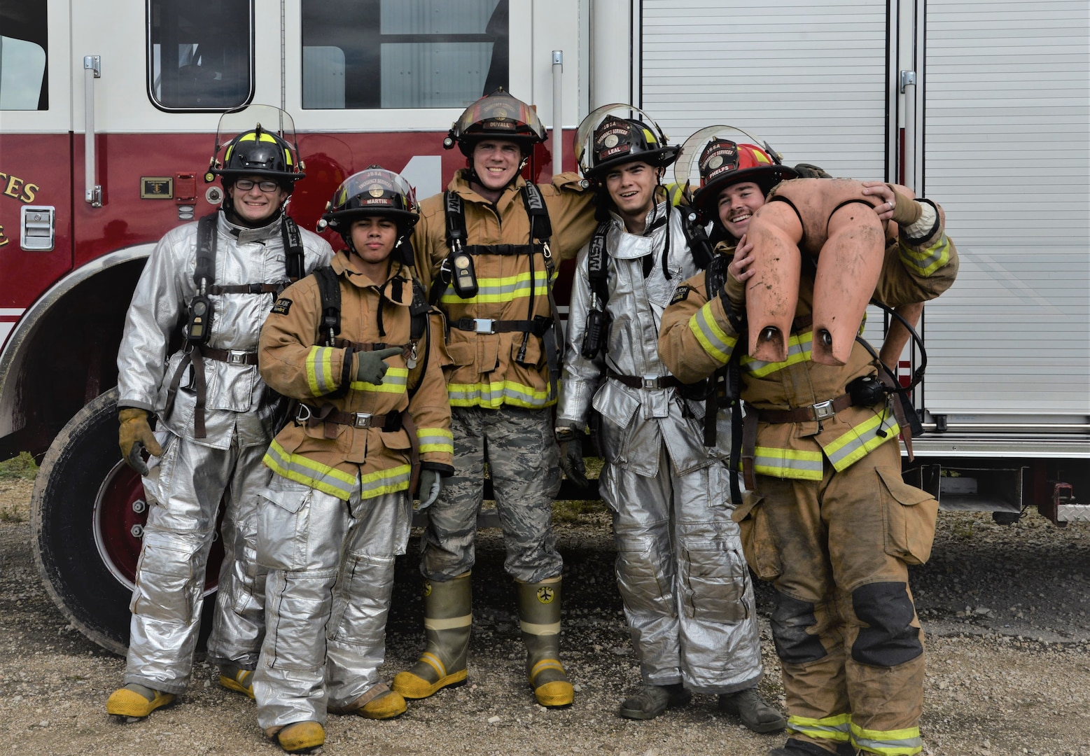 From left, Senior Airman Joshua Reeves, Airman 1st Class Jared Tajalle, Staff Sgt. Neal Kiser, A1C Eliot Elia and Senior Airman Patrick Sullivan make up the 902nd Security Forces Squadron five-man team that won the firefighter fitness challenge portion of the Battle of the Badges competition Oct. 20, 2018, at Joint Base San Antonio-Randolph’s Camp Talon. The initiative was designed to build stronger bonds between the agencies and has become a tradition for the unit members, their families and friends.