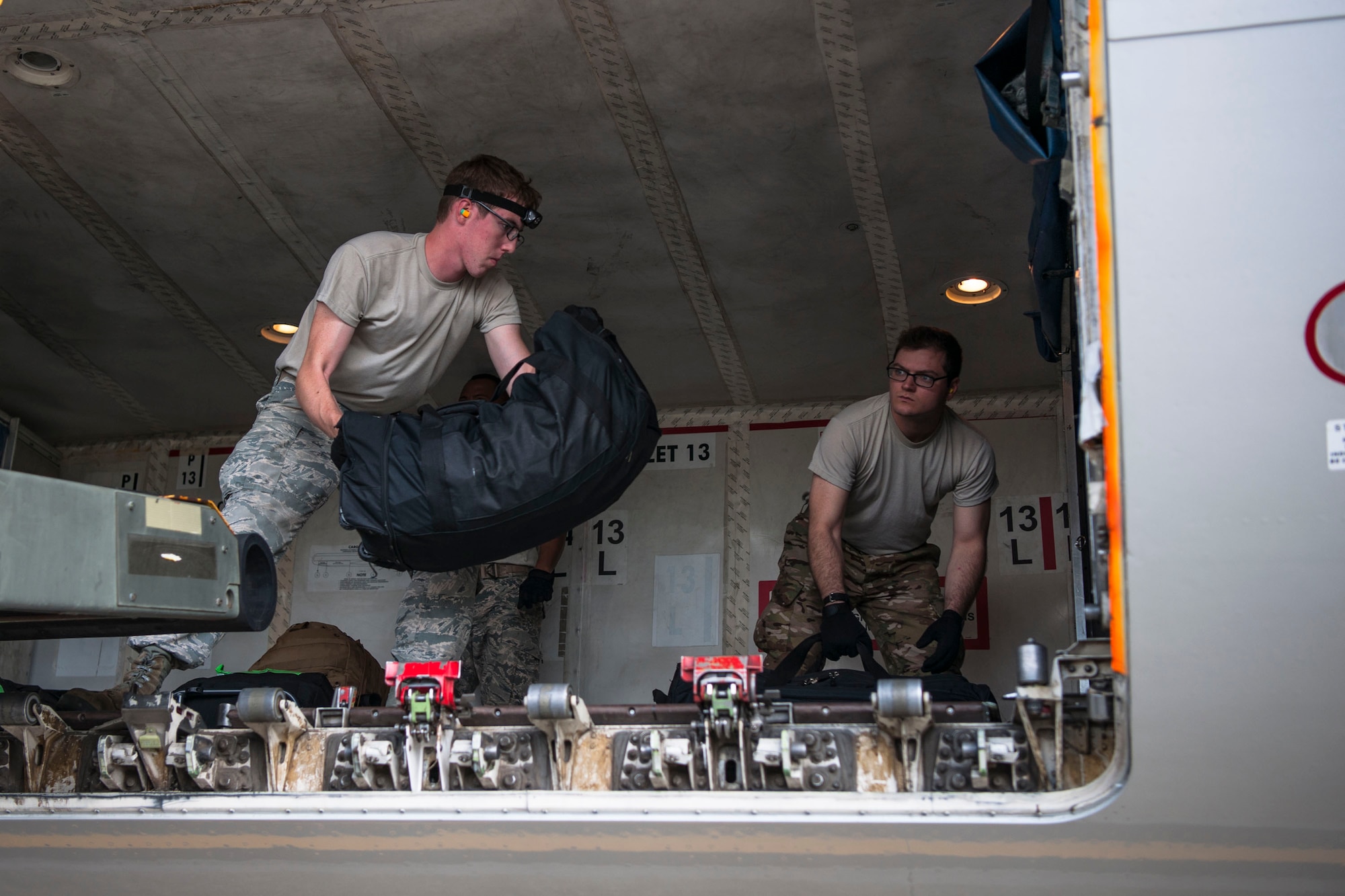 Airmen from the 23d Logistics Readiness Squadron load a Boeing 767-300ER, Oct. 24, 2018, at Moody Air Force Base, Ga. The 822d, 823d and 824th Base Defense Squadrons (BDS) provide high-risk force protection and integrated base defense for expeditionary air forces. Airmen from the 823d BDS just returned home from conducting relief-in-place in the United States Africa Command theater while Airmen from the 824th BDS took their place. (U.S. Air Force photo by Airman Taryn Butler)