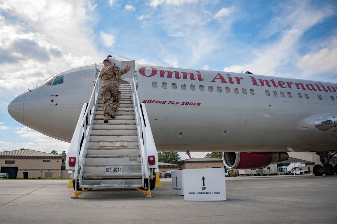 Airmen from the 820th Base Defense Group carry boxes onto a Boeing 767-300ER, Oct. 24, 2018, at Moody Air Force Base, Ga. The 822d, 823d and 824th Base Defense Squadrons (BDS) provide high-risk force protection and integrated base defense for expeditionary air forces. Airmen from the 823d BDS just returned home from conducting relief-in-place in the United States Africa Command theater while Airmen from the 824th BDS took their place.
(U.S. Air Force photo by Airman Taryn Butler)