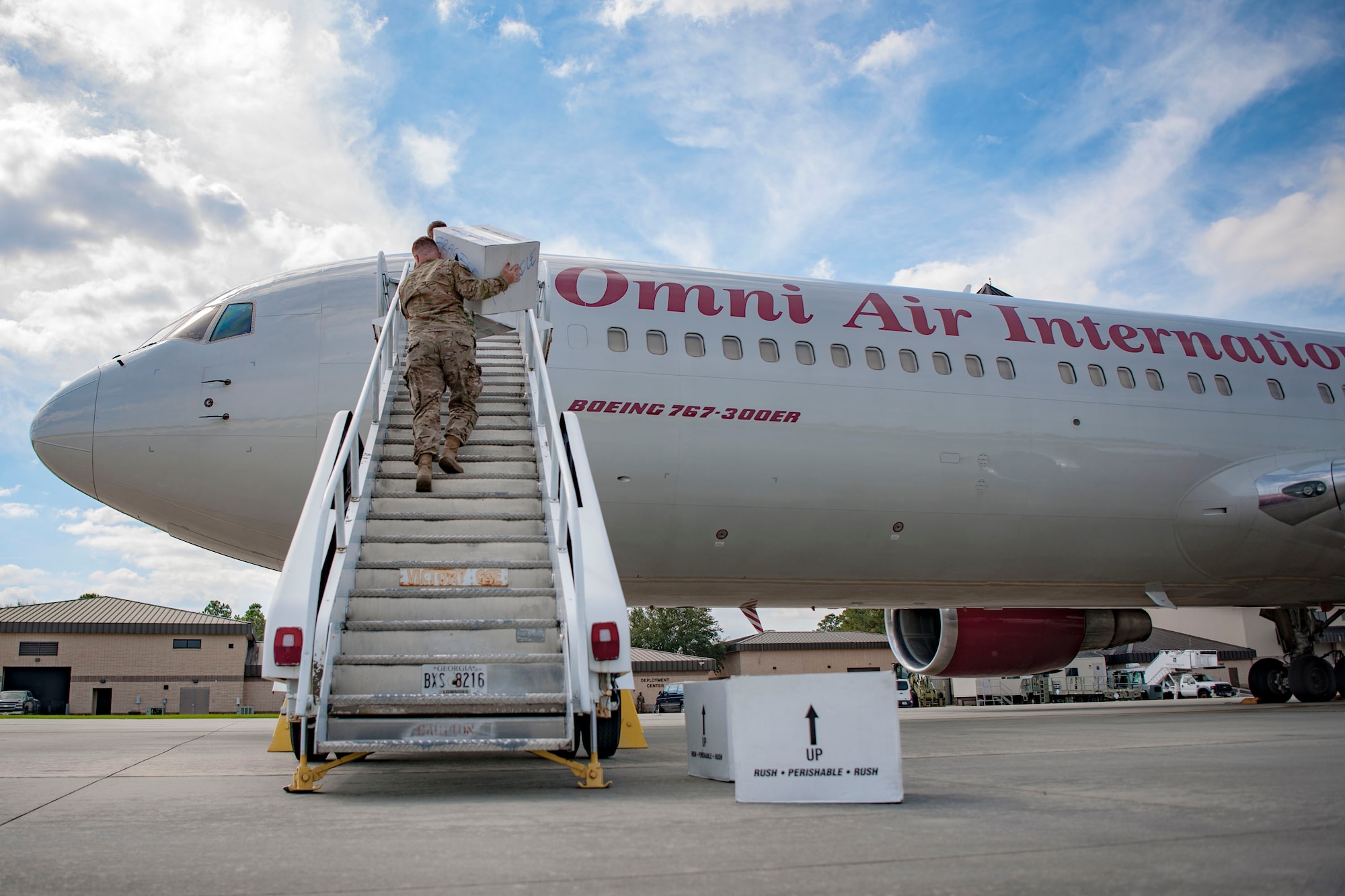Airmen from the 820th Base Defense Group carry boxes onto a Boeing 767-300ER, Oct. 24, 2018, at Moody Air Force Base, Ga. The 822d, 823d and 824th Base Defense Squadrons (BDS) provide high-risk force protection and integrated base defense for expeditionary air forces. Airmen from the 823d BDS just returned home from conducting relief-in-place in the United States Africa Command theater while Airmen from the 824th BDS took their place.
(U.S. Air Force photo by Airman Taryn Butler)