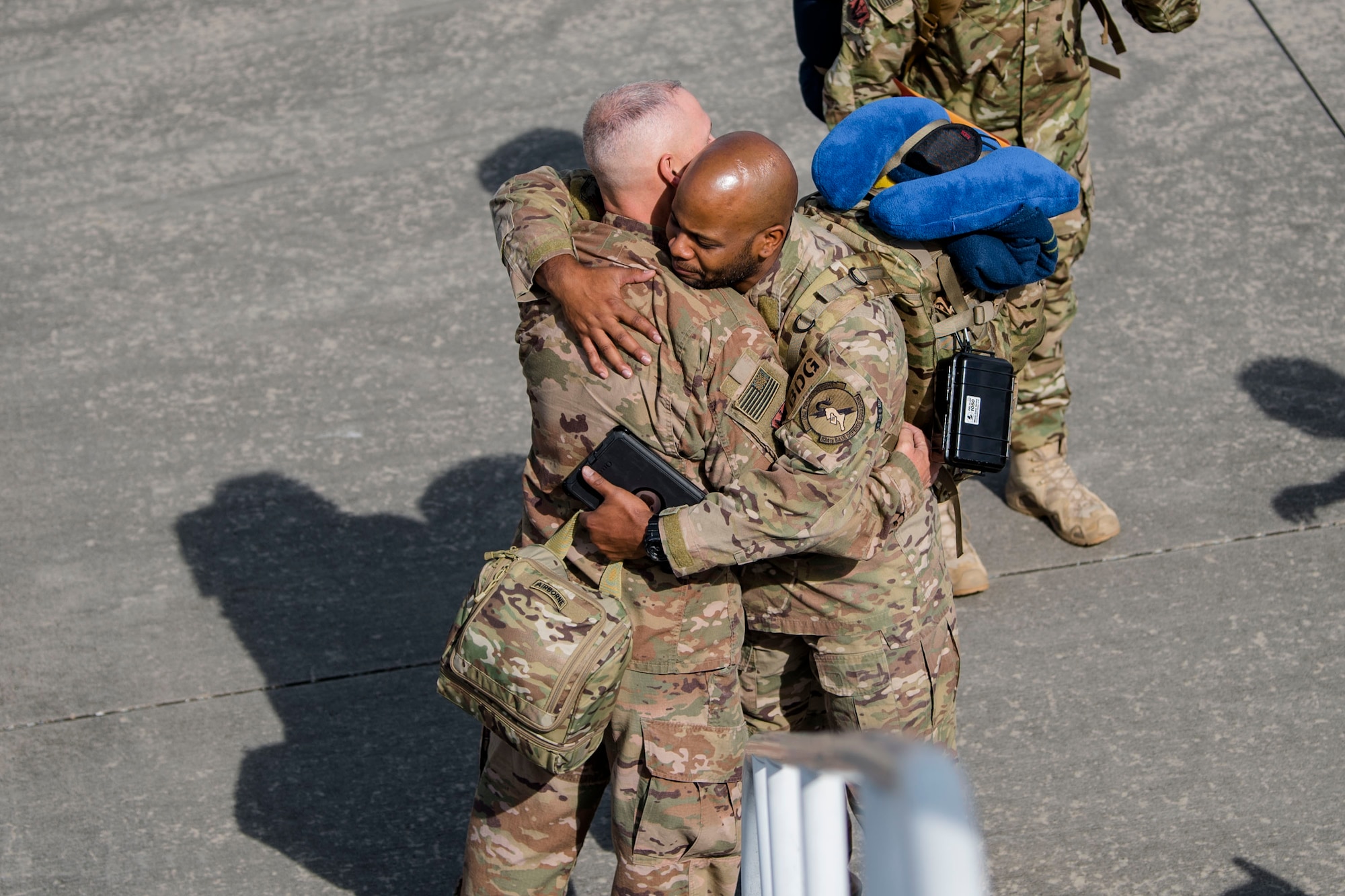 Chief Master Sgt. Larry Mays, 824th Base Defense Squadron (BDS) security forces manager, hugs Tech. Sgt. Justin Amburgey, 824th BDS squad leader, Oct. 24, 2018, at Moody Air Force Base, Ga. The 822d, 823d and 824th Base Defense Squadrons (BDS) provide high-risk force protection and integrated base defense for expeditionary air forces. Airmen from the 823d BDS just returned home from conducting relief-in-place in the United States Africa Command theater while Airmen from the 824th BDS took their place. (U.S. Air Force photo by Airman Taryn Butler)
