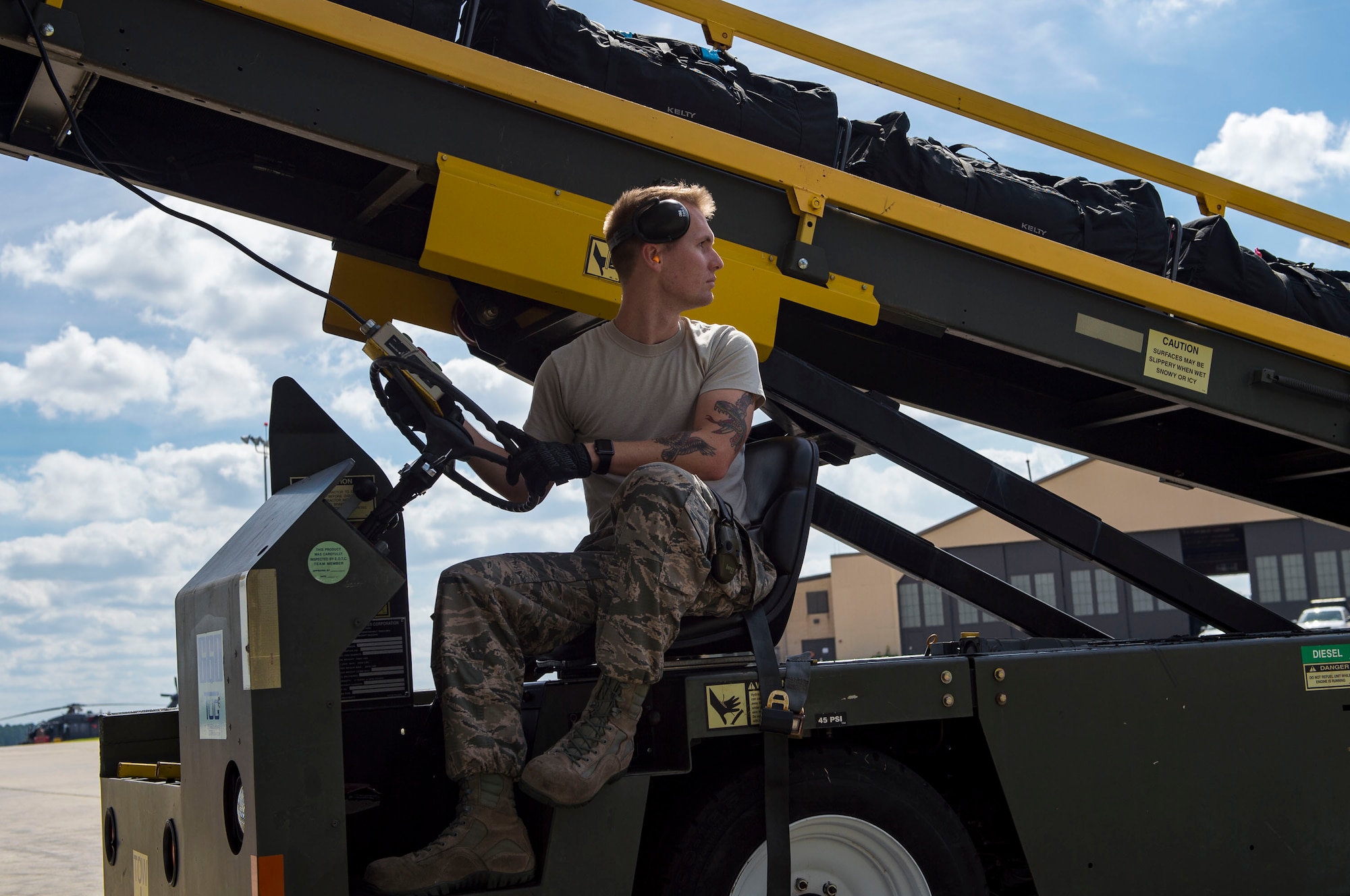 Senior Airman Zachary Darling, 23d Logistics Readiness Squadron air transportation specialist, runs a conveyor belt, 0ct. 24, 2018, at Moody Air Force Base, Ga. The 822d, 823d and 824th Base Defense Squadrons (BDS) provide high-risk force protection and integrated base defense for expeditionary air forces. Airmen from the 823d BDS just returned home from conducting relief-in-place in the United States Africa Command theater while Airmen from the 824th BDS took their place. (U.S. Air Force photo by Senior Airman Janiqua P. Robinson)