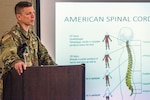 U.S. Army Capt. Domenico Lazzaro, a specialty branch recruiter with the New Jersey Army National Guard, shows the audience a slide of the different levels of spinal cord injuries during the National Disability Employment Awareness Month observance at Joint Force Headquarters located at Joint Base McGuire-Dix-Lakehurst, N.J., Oct. 18, 2018. On June 11, 2017, Lazzaro fell while navigating an obstacle course at Joint Base McGuire-Dix-Lakehurst and fractured his T8 vertebrae. The seven-hour surgery left him paraplegic. Lazzaro’s goal is to be able to pass the Army physical fitness test and continue to serve in the Guard.