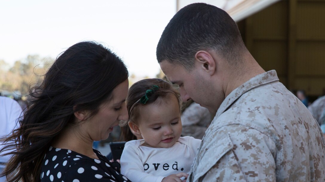 MARINE CORPS AIR STATION CAMP PENDLETON, Calif.- U.S. Marine Sgt. Justin Patino, a tiltrotor crew chief with Marine Medium Tiltrotor Squadron (VMM) 164, Marine Aircraft Group (MAG) 39, 3rd Marine Aircraft Wing (MAW), embraces his family at Marine Corps Air Station Camp Pendleton, Calif., Oct. 17. VMM-164 returned from a six-month deployment in Kuwait while attached to Special Purpose Marine Air Ground Task Force-Crisis Response-Central Command (SPMAGTF-CR-CC). (U.S. Marine Corps photo by Lance Cpl. Julian Elliott-Drouin)